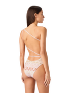 Woman wearing a lace one-piece swimsuit on a white background