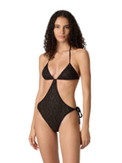 Woman wearing a black patterned swimsuit on a white background