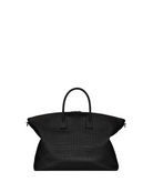 Black textured handbag on a light gray background