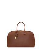 Brown leather handbag with a gold lock on a white background