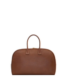 Brown leather handbag on a white background