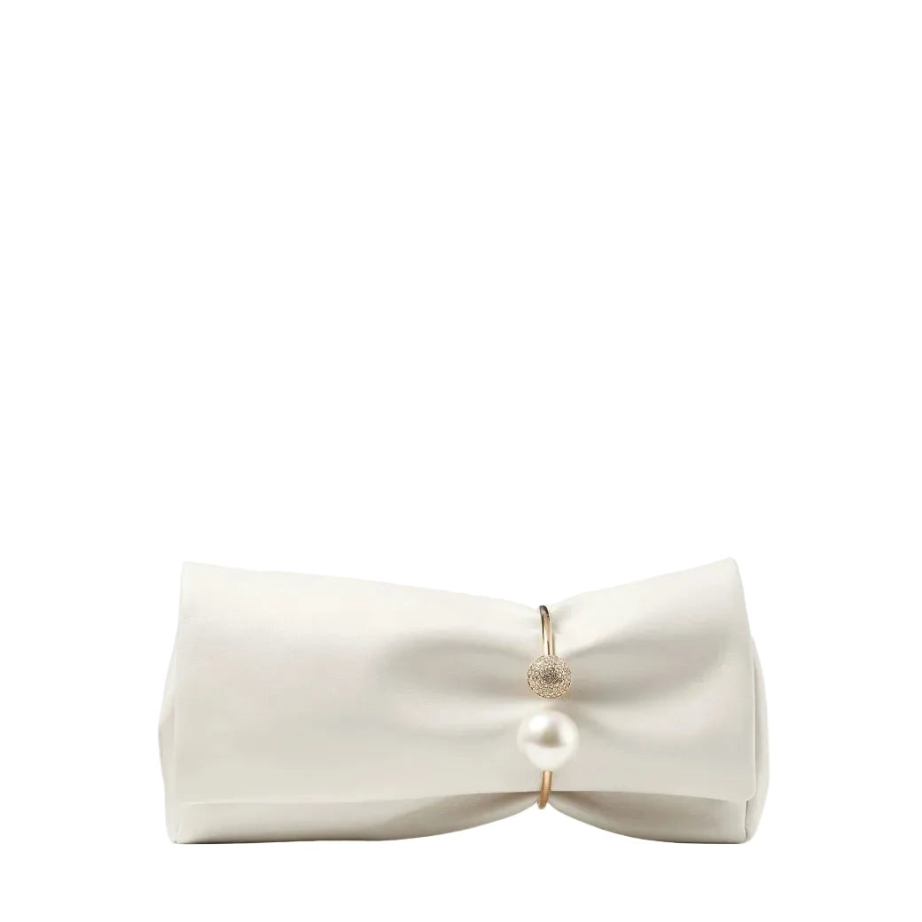 White bandeau top with a pearl and gold detail on a white background