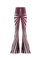 A pair of high-waisted flared pants featuring a bold, symmetrical spiral stripe pattern in black, magenta, and white, presented on a clean white background.