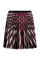 A pleated A-line mini skirt featuring a bold geometric pattern in black, hot pink, and white, displayed against a light gray background.