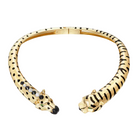 Gold bracelet with leopard and tiger head designs on a light gray background