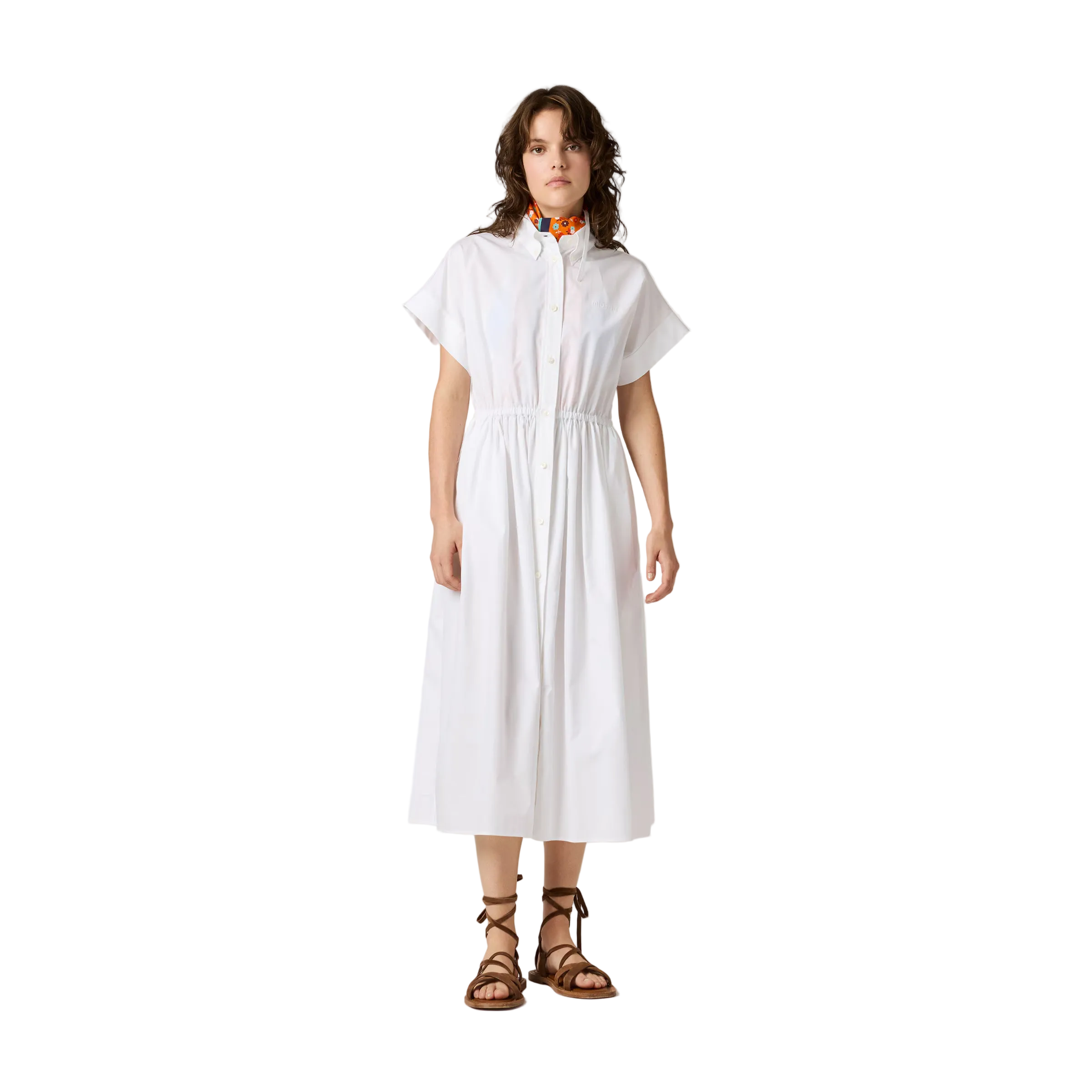 Woman wearing a white dress on a beige background