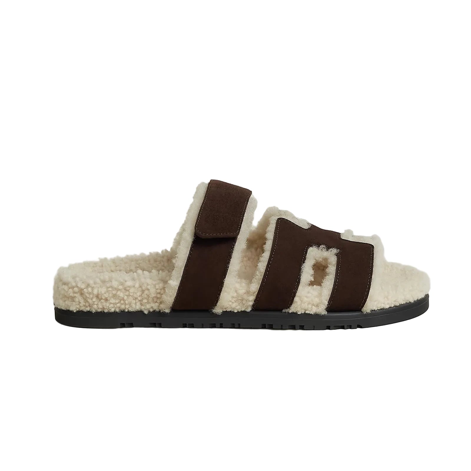 Brown and white slide sandal on a light gray background