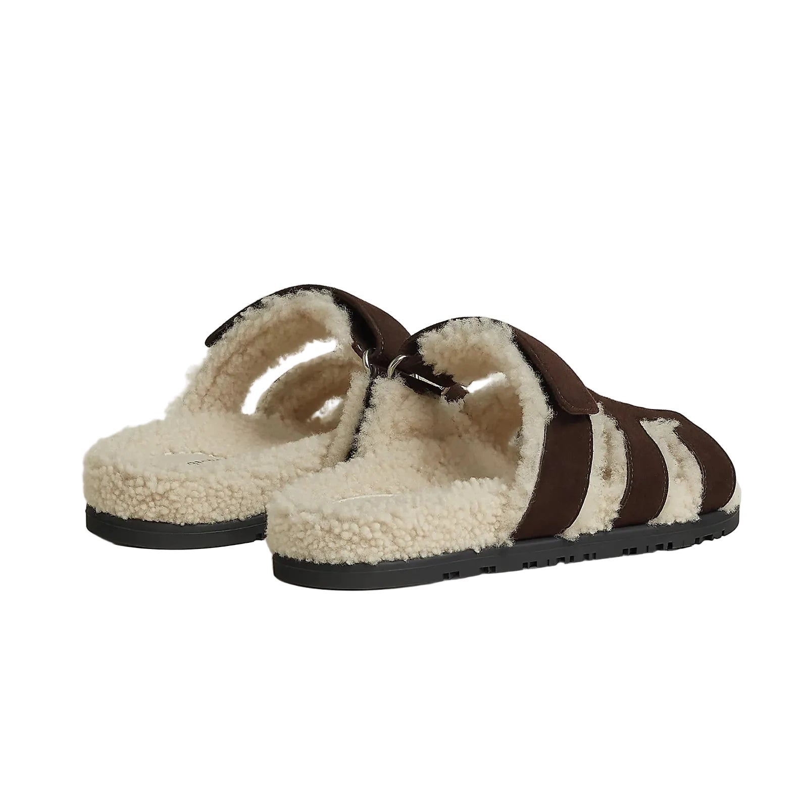 Pair of brown and beige slippers on a light background