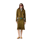Woman wearing a green coat with a white background
