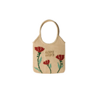 Beige handbag with floral embroidery on a beige background
