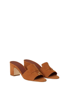 Pair of brown open-toe heeled sandals on a white background