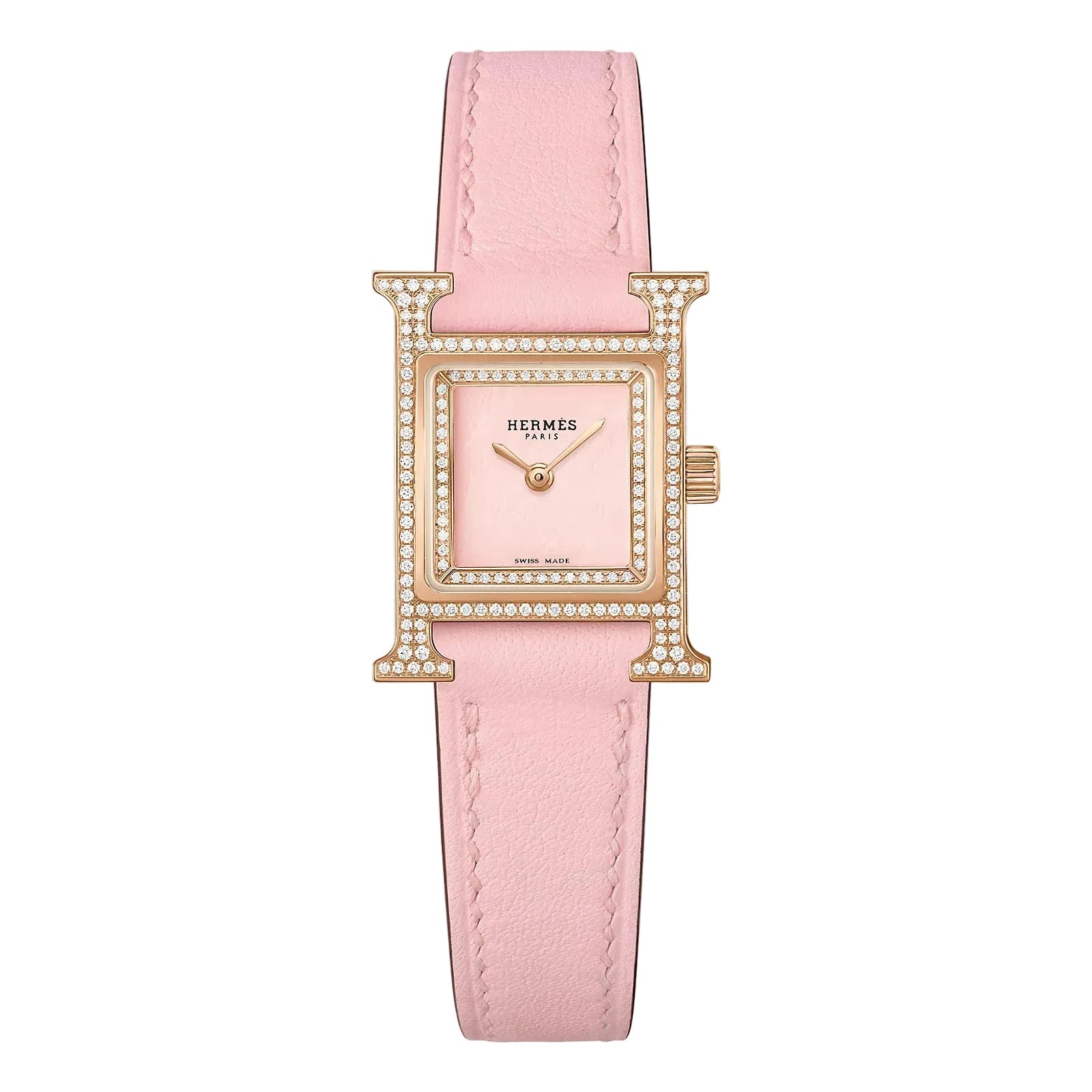 Hermes watch with pink strap on a light gray background