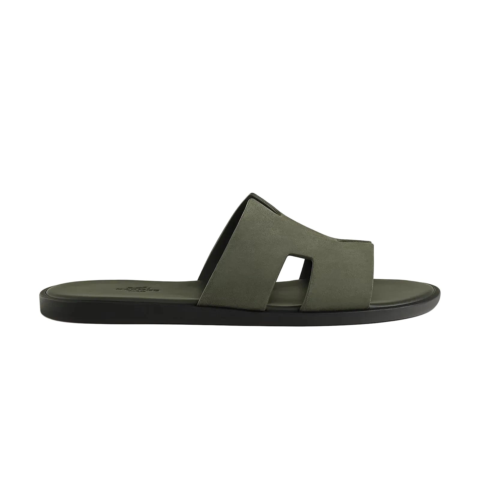 Green sandal with a black sole on a light gray background