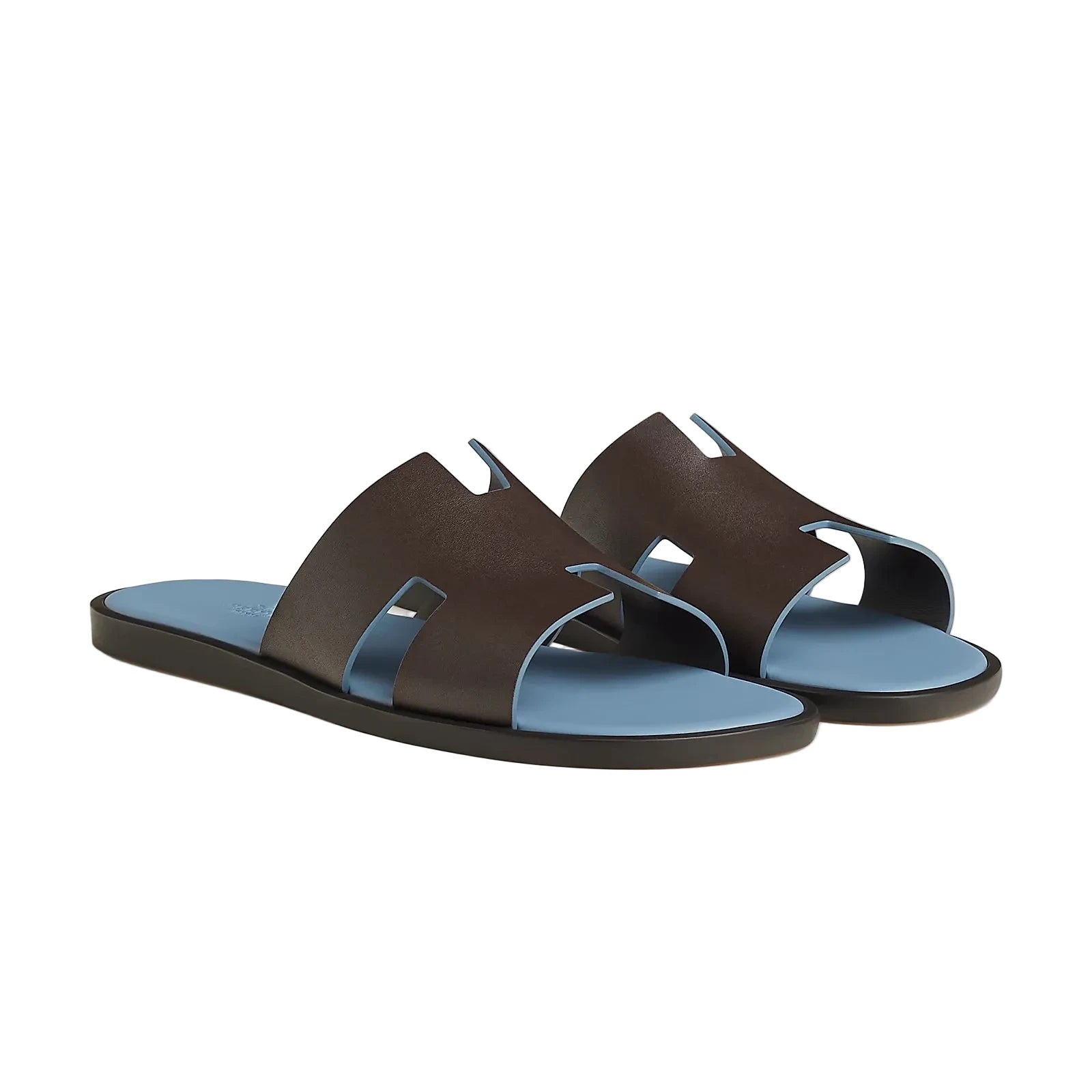 Pair of brown sandals with blue soles on a light gray background