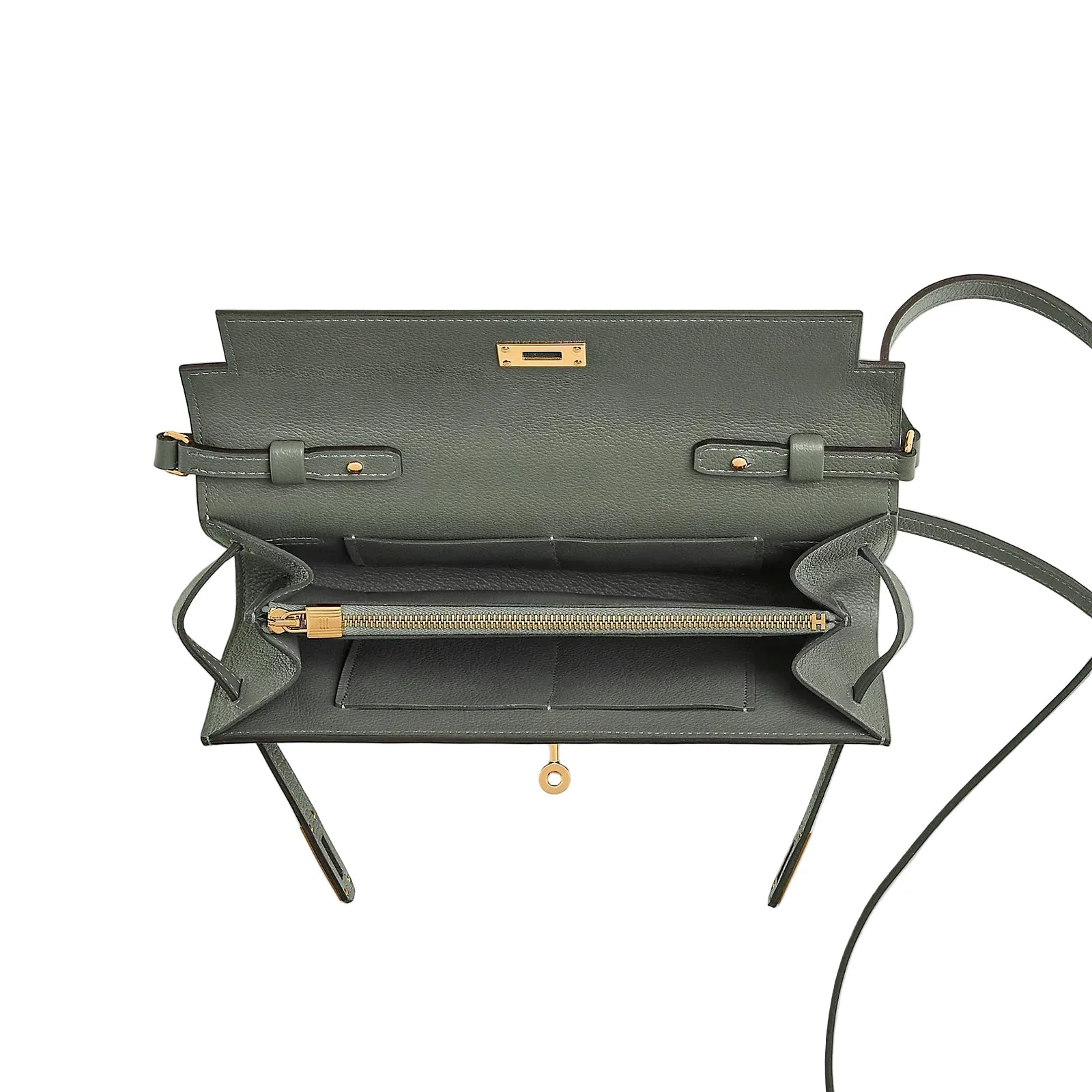 Green leather handbag with gold accents on a light gray background