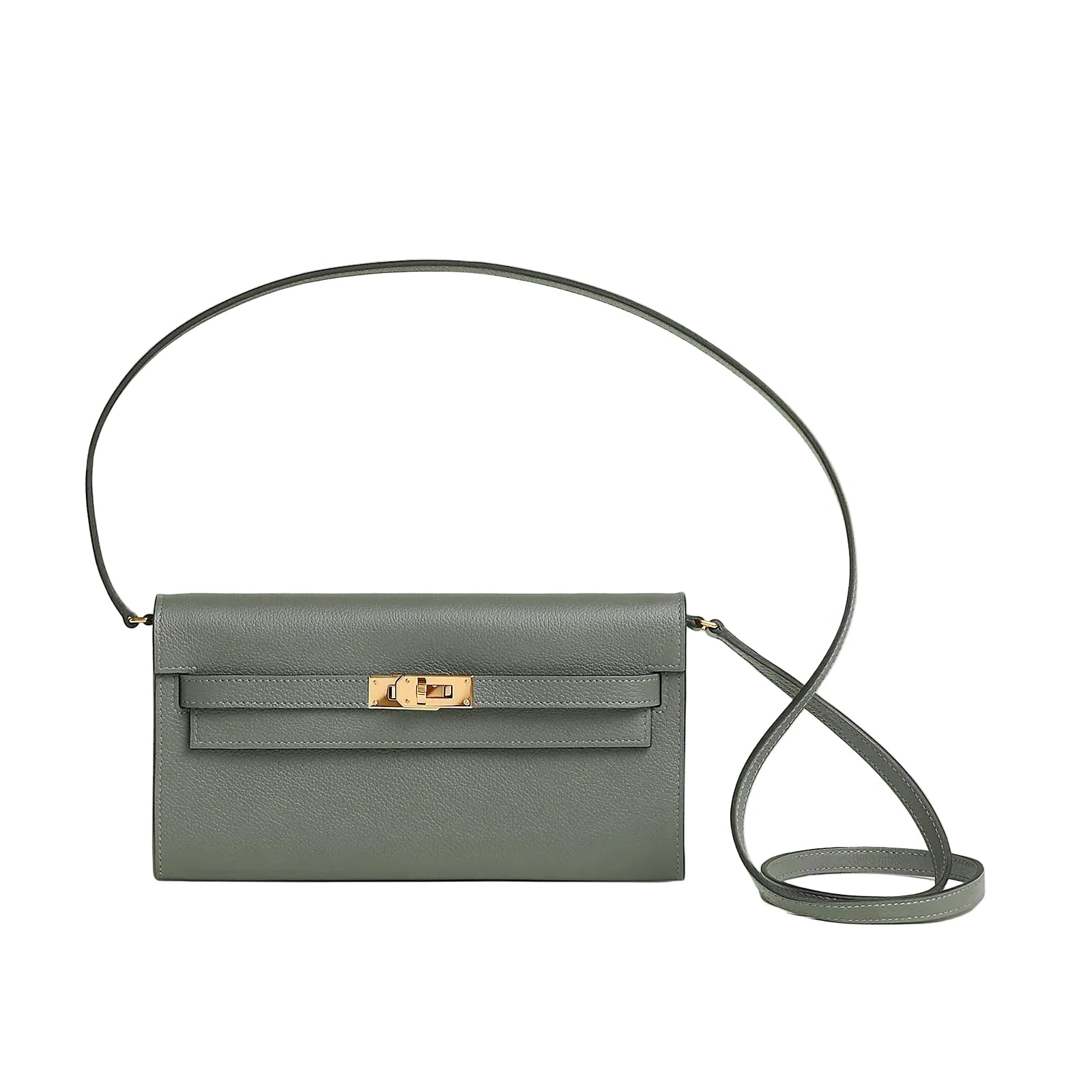 Green handbag with a strap on a light gray background