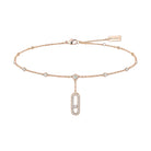 Rose gold bracelet with diamond accents on a white background