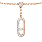 Rose gold necklace with diamond pendants on a white background