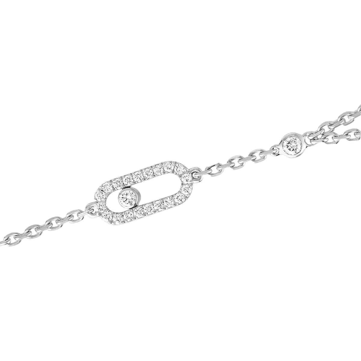 Silver bracelet with diamond accents on a white background