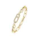 Gold chain bracelet with diamond accents on a white background