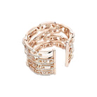Rose gold ring with diamond accents on a white background