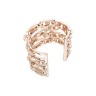 Rose gold ring with intricate design on a white background