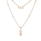 Rose gold necklace with pendant on a white background