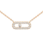 Rose gold necklace with diamond accents on a light beige background