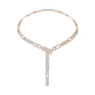 Rose gold necklace with clear gemstones on a white background
