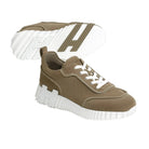 Brown sneakers with white soles on a light gray background