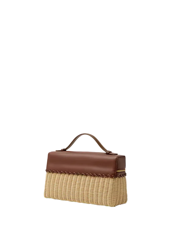 Brown and beige handbag on a light beige background