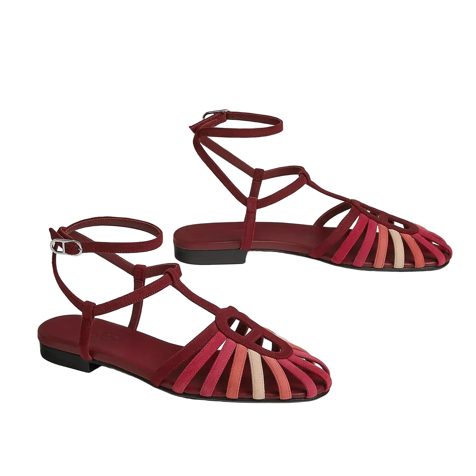 Red strappy sandals on a light gray background