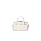 A white leather handbag with gold-tone studs and a top handle, photographed against a solid light beige background.