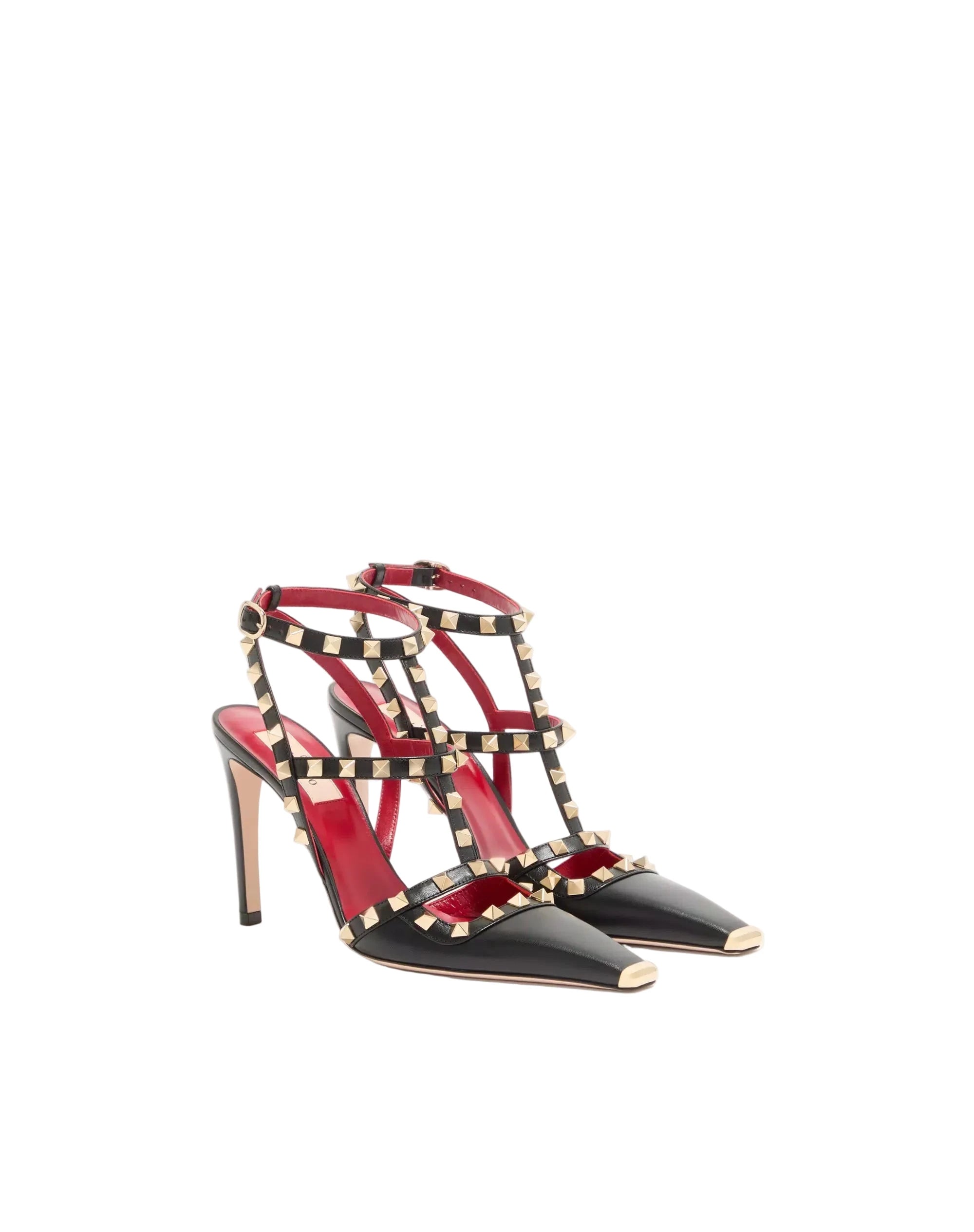 Black high-heeled shoes with red interior and gold accents on a white background